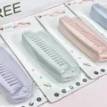 Detailed view of portable folding hair combs in pastel colors displayed with clean hanging cards. - Multicolor Blister Pack