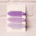 Detailed close-up of minimalist purple matte hair clips on white card, smooth finish. - 3 Pieces/Pack / Three Clips Leaf - Purple Series