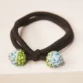 Close-up detail view of elegant black elastic hair tie with sparkling crystal rhinestone beads. - Blue Strawberry