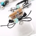Detailed shot of bow flower hair tie with pearl and metal leaf decoration, elegant style. - Leaf Single Bead Style 6