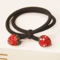 Black elastic hair tie featuring sparkling rhinestone strawberry charms for women and girls daily styling. - Red Strawberry