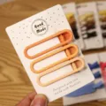 Simple matte orange hair clip set for women, stylish minimalist metal hairpin detail view for daily wear. - 3 Pieces/Pack / Three Clips Oval - Orange Series
