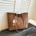 Brown PU leather tote bag for women, large capacity shoulder bag with cute fluffy charm. - Brown with Pendant