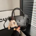 Classic black leather handbag for women, vintage crossbody shoulder bag with cute plush bear. - Black With Pendant