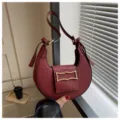 Red crescent shoulder bag for women, stylish underarm crossbody bag with metal buckle. - Red