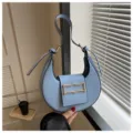 Light blue crescent shoulder bag for women, trendy niche underarm bag with gold hardware. - Sky Blue