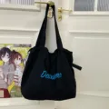 Black drawstring tote bag, large capacity canvas shoulder bag for casual daily commuter use. - Black