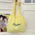 Yellow drawstring tote bag, lightweight commuter shoulder bag with green letter print for daily use. - Yellow
