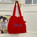 Red drawstring canvas tote bag, lightweight commuter shoulder handbag with blue letter print. - Red