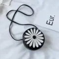 Kids black round crossbody bag with cute white daisy flower design, stylish PU leather purse. - Black