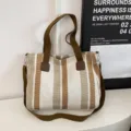 Fashion striped canvas shoulder bag for women, casual tote handbag with crossbody strap. - White