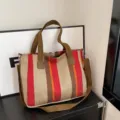 Stylish striped canvas tote bag for women, versatile shoulder and crossbody bag for commute. - Red