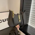 Black hobo shoulder bag for women, chic PU leather purse with gold chain and metal lock. - Black