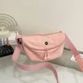 Stylish minimalist pink dumpling shoulder bag for women, ideal for daily commuting use. - Pink