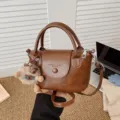 Women brown vintage PU leather handbag stylish casual shoulder crossbody bag with cute plush charm. - Light Brown With Pendant