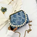 Chic denim kiss-lock handbag featuring elegant pearl handle and gold chain strap. - Blue Style 2
