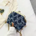 Stylish blue denim kiss-lock shoulder bag with gold chain strap and elegant pearl charm. - Dark Blue Style 2