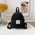 Stylish mini corduroy backpack for women, retro small casual daypack for daily travel and work. - Black