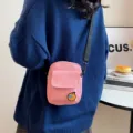 Cute pink canvas crossbody bag for daily casual wear, small messenger bag with orange patch. - Pink