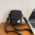 Black canvas crossbody bag, small shoulder bag variant with cute fruit badge and adjustable strap. - One Size / Black