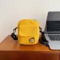 Yellow canvas crossbody bag with cute orange patch, casual shoulder bag for students. - One Size / Yellow