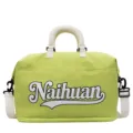 Sac de voyage vert avec poignées blanches et bandoulière pour le sport et trajets. - Vert