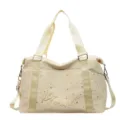Stylish beige travel duffel bag with gold star prints and sturdy shoulder straps for women. - Yellow