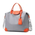 Large capacity travel duffel bag waterproof nylon shoulder bag with orange leather trim. - Grayish Orange