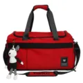 Red travel duffel bag with black handles, shoulder strap and cute doll pendant for trips. - Red without Pendant