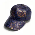Close-up detail of the stylish blue denim baseball cap featuring a chic metallic gold leopard print pattern. - Adjustable Adult Size / Medium Blue Gold Leopard