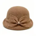 Detailed view of the brown wool blend cloche hat featuring a chic bow and rhinestone accent. - M (56-58cm) / Camel