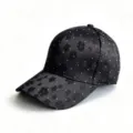 Close-up detail of women's black embroidered floral baseball cap with chic white dot accents. - One Size(Adjustable) / Black