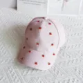Close-up of pink waffle texture baseball cap decorated with rhinestones and cute red cherries. - Cherry / Adult Adjustable / Pink