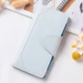 Portafoglio lungo da donna azzurro chiaro con chiusura a pressione e scomparti per carte. - Azzurro
