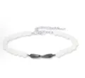 Fashion white bead bracelet with dark metal twist pendant and adjustable extension chain. - Mobius Men (S689)