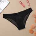 Detailed view of women's sexy breathable black lace embroidered underwear, delicate floral lace design. - S / Black