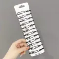Set μαύρα τσιμπιδάκια μαλλιών σε χαρτόνι, μινιμαλιστικός κυματιστός σχεδιασμός για καθημερινό styling. - Σχήμα κύματος / Πακέτο 10 Τεμαχίων