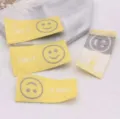 Colorful smile woven labels for DIY hair accessories, cute fabric clothing tags and patches. - 1 Piece / Yellow