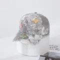 Close-up of grey tie-dye baseball cap featuring dazzling rhinestones and cute butterfly details. - Adult Adjustable / Gray