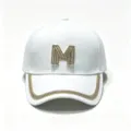 Close up of white baseball cap with rhinestone M logo and glittering crystal brim trim. - White / Adult, Hat Circumference 58cm Adjustable