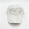 Close-up view of the white thick corduroy texture and curved brim detail of the baseball cap. - Adult, 56cm Adjustable / White