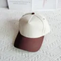 Close-up view of the two-tone cotton baseball cap, featuring a clean off-white crown and brim. - Beige & Coffee / 54-59cm Adjustable