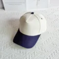 Detailed view of a two-tone cotton baseball cap with structured panels and a curved brim. - Beige+Navy Blue / 54-59cm Adjustable