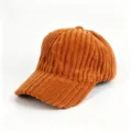 Detailed close-up of a brown corduroy baseball cap, featuring soft textured fabric and curved brim. - Adult, 56cm Adjustable / Caramel color