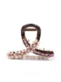Vista di dettaglio di un elegante mollettone floreale rosa, accessorio con strass. - 8cm / Rosa