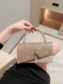 Elegant sparkling evening handbag with metallic V clasp and glitter finish for women main - Gold