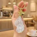 Clear acrylic sea star keychain with gold hardware, cute bag charm and chic accessory. - Iridescent Conch Keychain (Clear White)