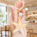 Colorful iridescent starfish acrylic keychain with pearl pendant for bags and keys. - Iridescent Starfish Keychain (Yellow)