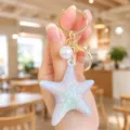 Iridescent starfish keychain with pearl and gold ring, cute summer bag charm and accessory. - Iridescent Starfish Keychain (White)
