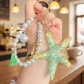 Starfish pearl keychain pendant, summer ocean style resin charm with tassel for bags. - Green